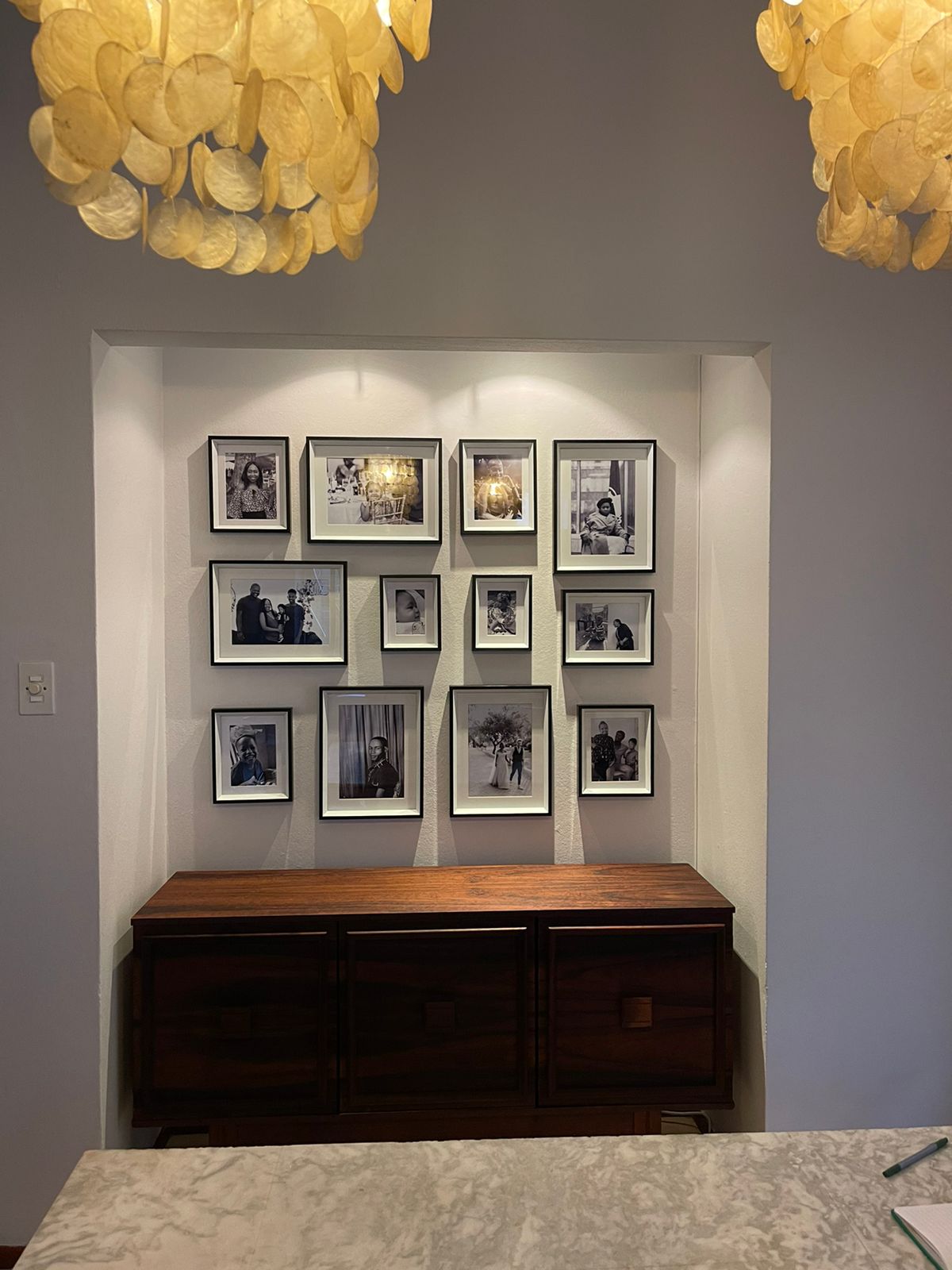 Handyman: Wall with pictures and a cupboard underneath it